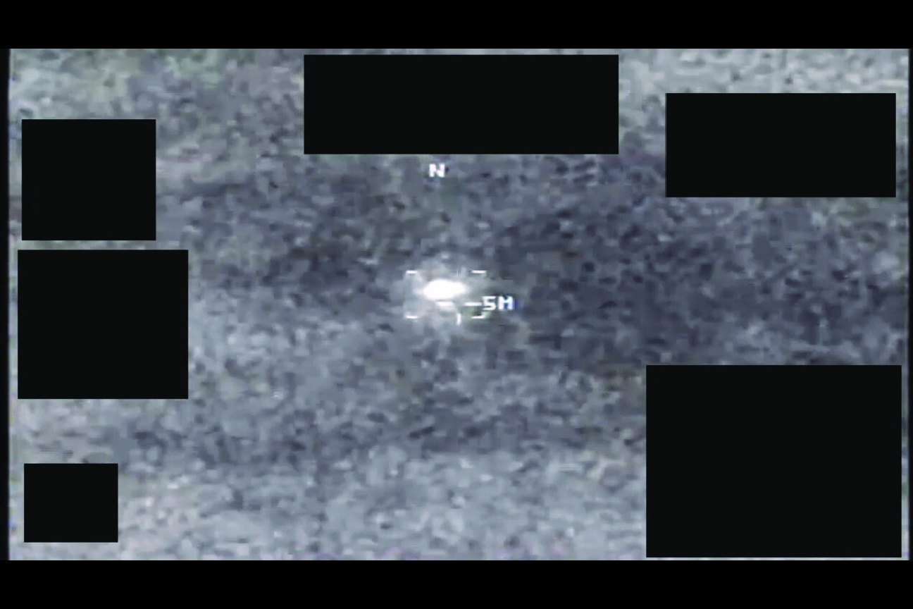 A screenshot from a video likely derived from an infrared sensor, with a prominent area of contrast near the center of the screen.