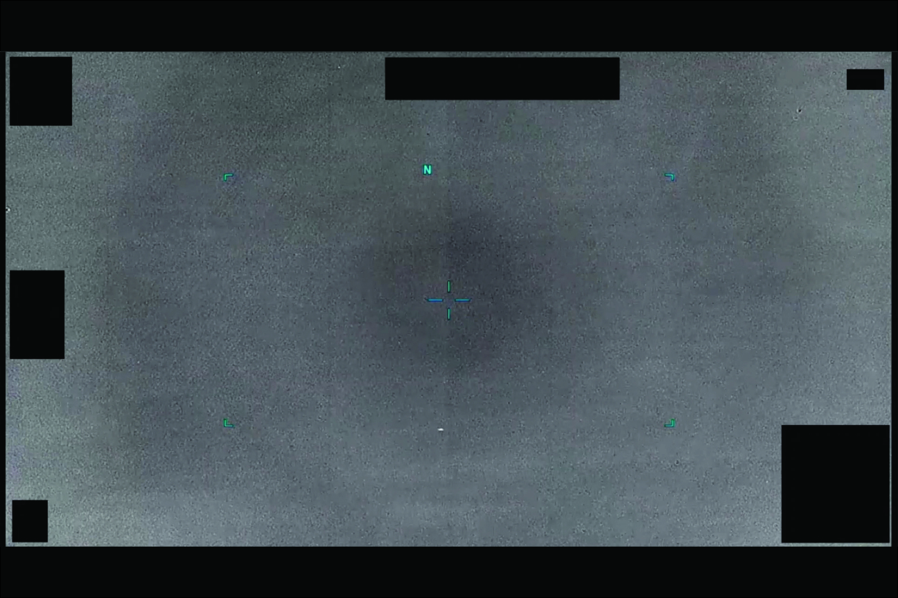 Aqua-colored scope lines are shown over a gray background, with a scattering of clouds and black squares and rectangles.