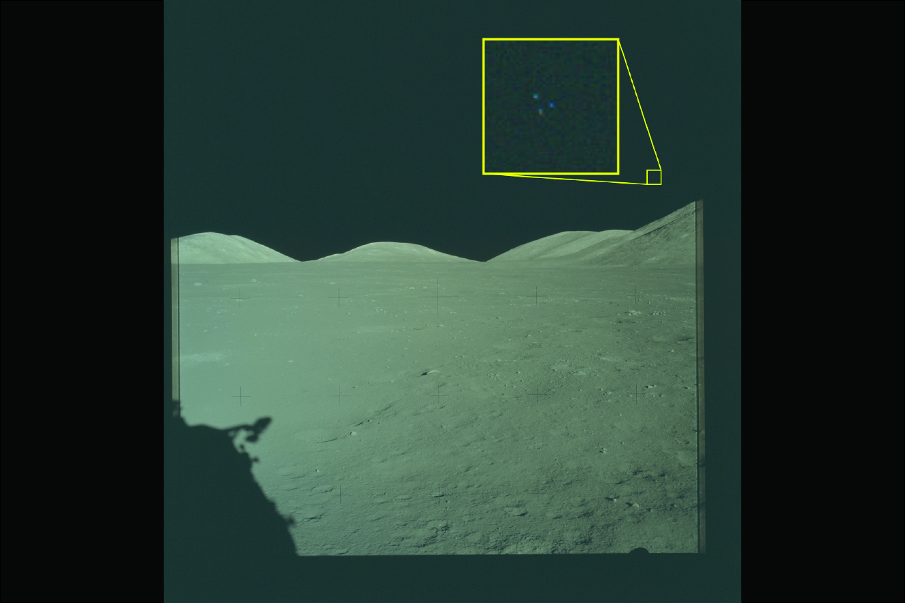 Archival imagery from the Apollo 17 mission to the Moon. The yellow box contains an enlarged area of the original photo in which three lights are visible above the lunar terrain.